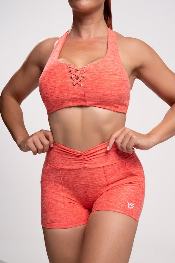 Conjunto deportivo de mujer corto de color naranja